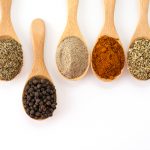 Spices and herbs on white background